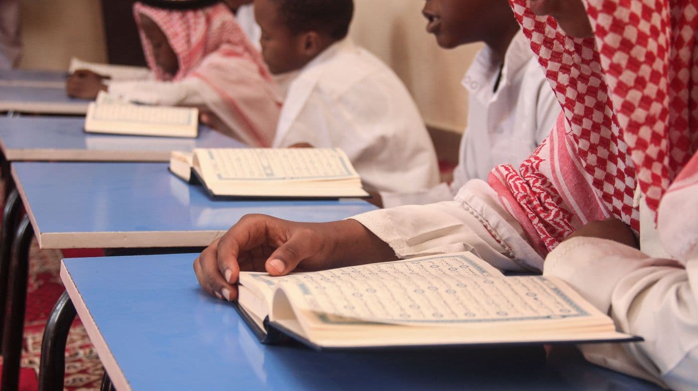 Students reading the Qur'an together during class
